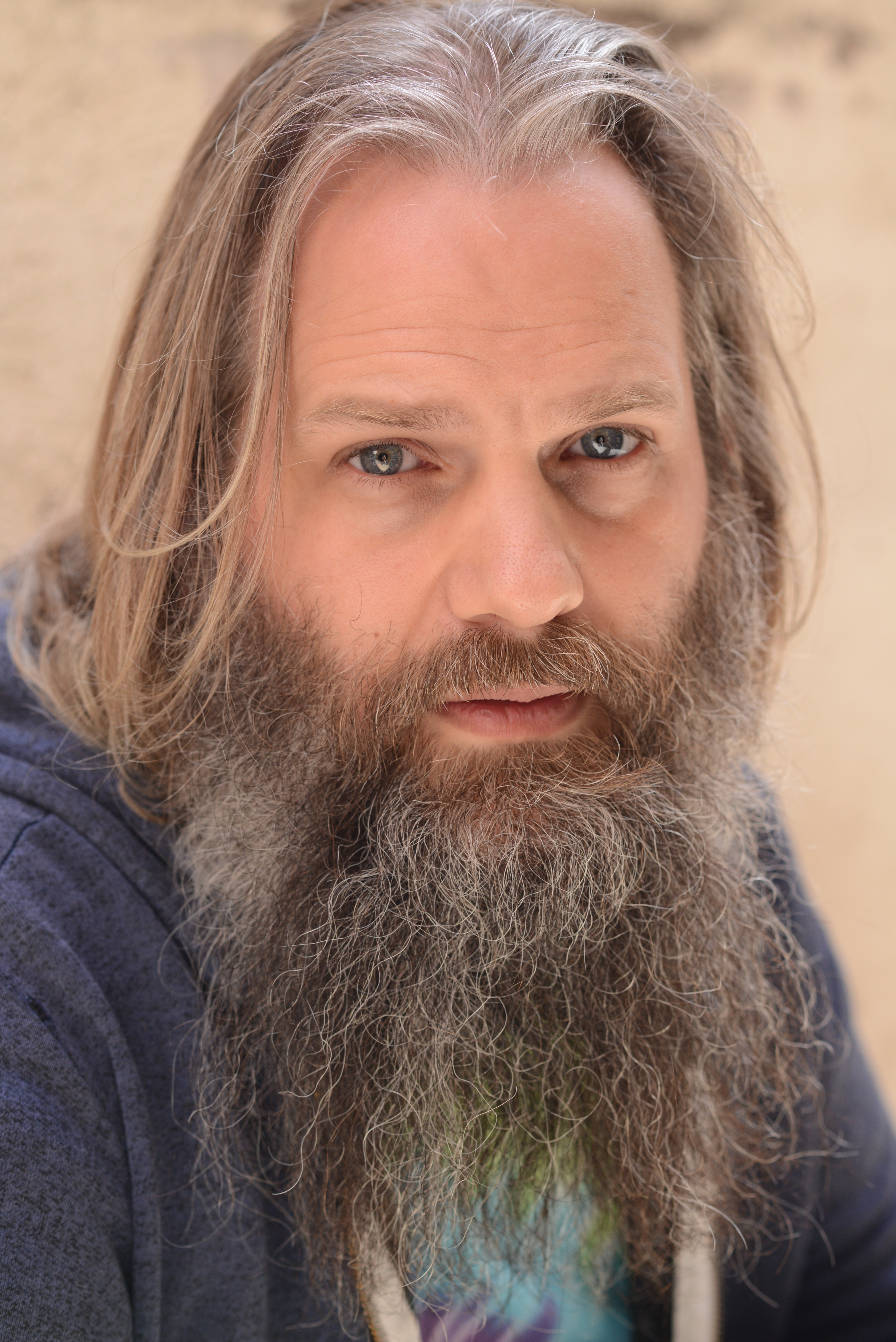 Bearded Man in looking somber