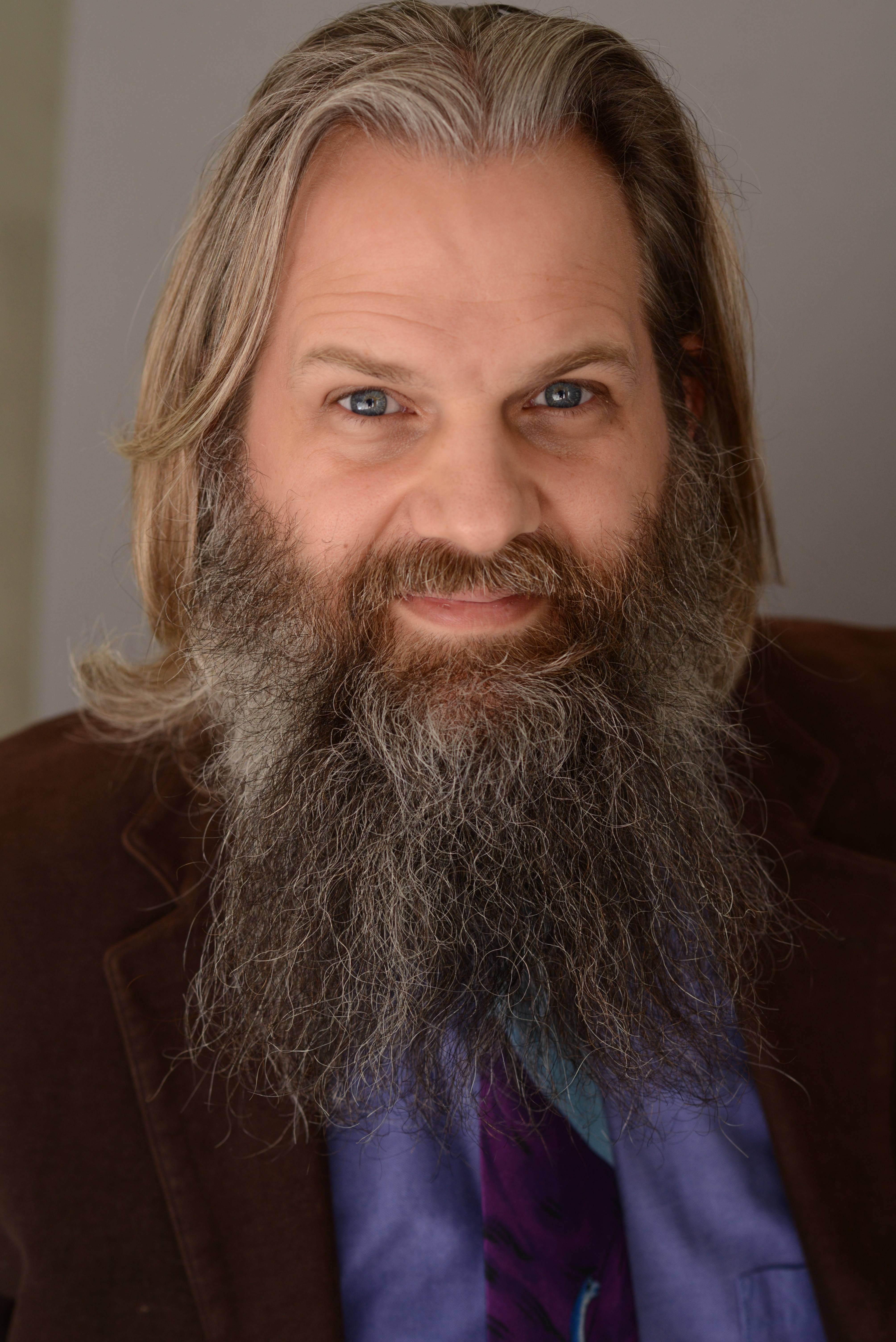 Bearded Man in sports coat and tie, looking like a professor